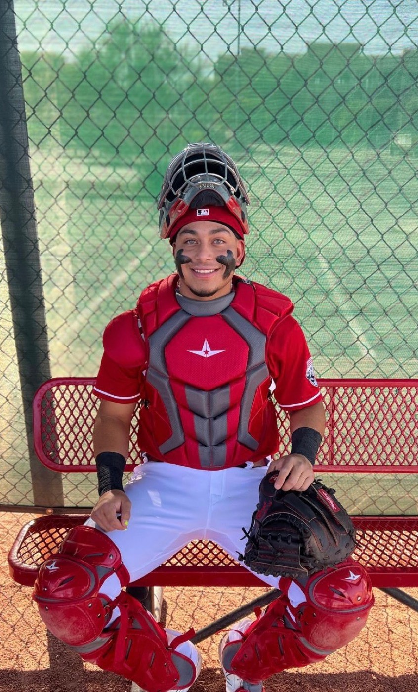 Coach Juan in catcher's gear